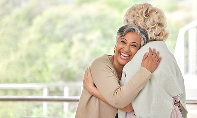 Image showing Love, hug and old woman friends on space together for a visit during retirement in a senior home. Portrait, smile and happy elderly people embracing for support, unity or solidarity while bonding