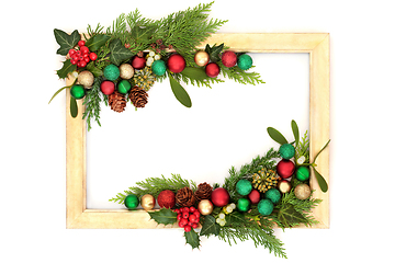 Image showing Christmas Colorful Bauble and Winter Greenery Background Frame