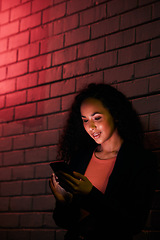 Image showing Phone, city night wall and woman typing, search internet or check mobile info, app or contact social media user. Red neon light, communication and person networking, relax or research cellphone news