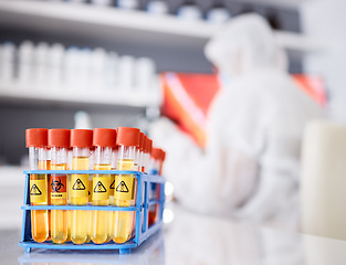 Image showing Science, closeup and test tube with warning in laboratory for medical research, healthcare and innovation with poison. Investigation, vial and sample of chemical or biohazard for professional study