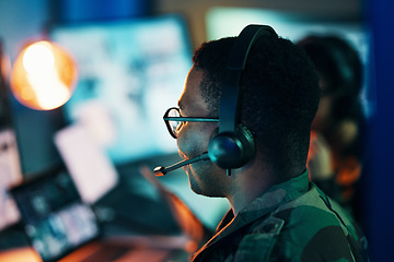 Image showing Military control room, computer and man and surveillance from back, tech and communication at desk. Security, global and soldier in army office at government cyber intelligence command center.
