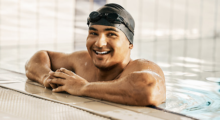 Image showing Happy, man and portrait of athlete in swimming pool after training, workout or exercise for wellness and cardio fitness in gym. Swimmer, relax or smile for sports, challenge or water polo competition