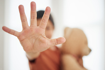 Image showing Hand, child and palm with stop for violence, abuse and warning sign in support for harassment and protection. Person, kid and no gesture for protest, fight or defence expression with empowerment