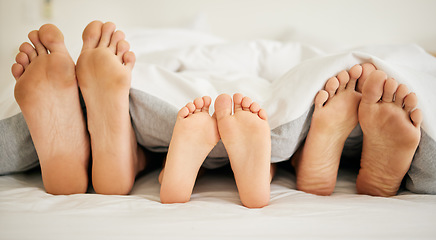 Image showing Feet, family and sleeping on bed in bedroom of home together for rest, relax and comfort in the morning. Apartment, mattress and people nap for stress relief, vacation or weekend in san francisco