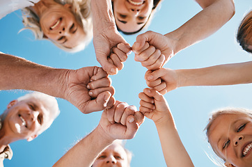 Image showing Happy big family, hands and fist bump in teamwork, motivation or unity for support or trust on sky background. Low angle of people smile touching in team collaboration, community or outdoor goals