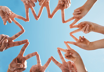 Image showing Hands, group and fingers in star for peace, collaboration and solidarity on blue sky in low angle. Family, shape and connection to network, team support and freedom of friends in cooperation to trust