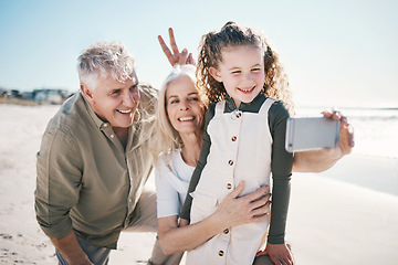 Image showing Family, selfie and beach holiday with peace sign, grandparents and young girl with a smile. Happy, child and love at the sea and ocean with a profile picture for social media on summer vacation
