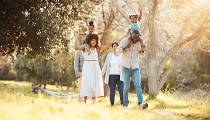 Image showing Big family, happy and walking at park together, care and bonding outdoor. Grandparents, kids and interracial mother and father in nature on holiday, travel vacation in garden and having fun at forest