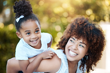 Image showing Happy, piggyback and mother with child in nature at an outdoor park playing, bonding and having fun. Smile, love and young mom carrying her girl kid or toddler walking in a green garden in Mexico.