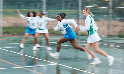 Image showing Sports, training and team netball competition, practice and women playing game, court challenge or action match. Fast motion blur, speed and group cardio workout, player teamwork and athlete running