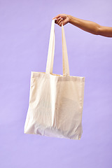 Image showing Sustainability, shopping and eco friendly bag by person or recycling customer isolated in a studio purple background. Environment, retail and woman with carbon footprint, zero waste and grocery