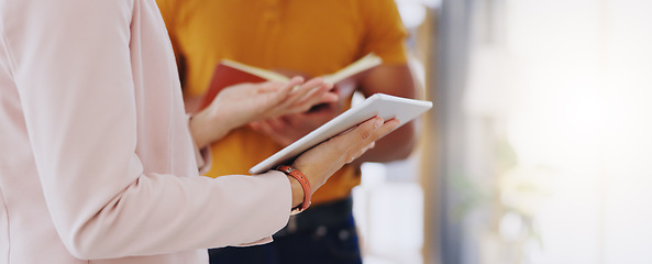 Image showing Closeup, teamwork and employees with a tablet, planning and share ideas in workplace. Coworkers, man and woman with technology, book and research with conversation, online reading and website launch