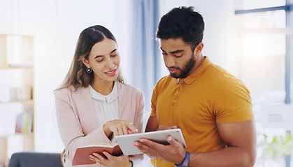 Image showing Business man, woman or partner with tablet with notebook, talking and team work for planning strategy. Businessman, partnership and reading notes for goals, ideas or collaboration at startup office