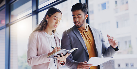 Image showing Collaboration, strategy and a business team walking in the office while talking about planning or the company mission. About us, teamwork and documents with corporate people writing in a notebook