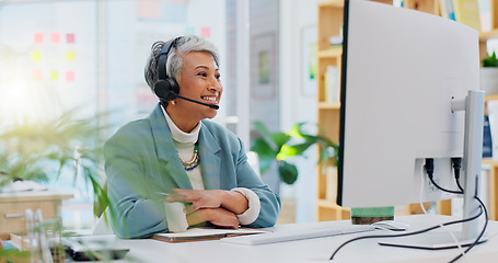 Image showing Consultant, senior woman and talking with technology at office for customer service at help desk call center. Sales, telemarketing and mature employee with headphones at work for crm with technical s