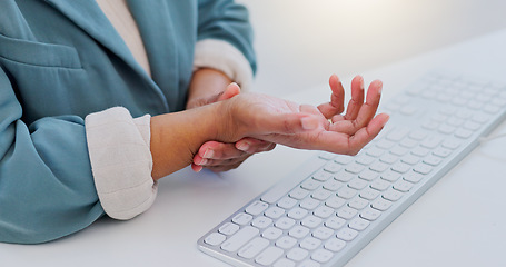 Image showing Business woman, hands and wrist pain from carpal tunnel syndrome, typing or injury on office desk. Closeup of female person with sore arm, inflammation or discomfort and joint ache at the workplace