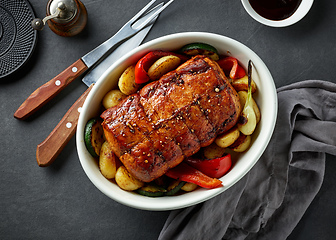 Image showing whole roast pork and vegetables