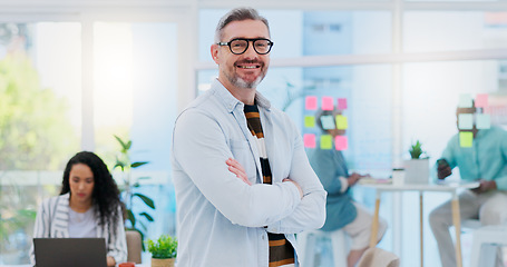 Image showing Happy, business pride and a man with arms crossed at a creative agency for consulting and design. Smile, confident and face portrait of a mature leadership management with technology for creative con