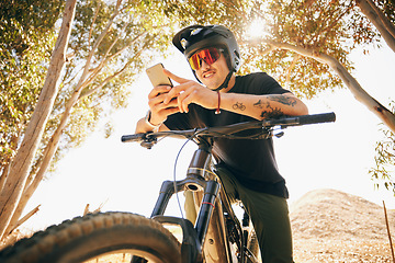 Image showing Bicycle, exercise and man with a cellphone, typing and connection with blog, influencer and social media. Person, biker or cyclist with a smartphone, digital app and internet with network and contact