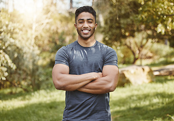 Image showing Happy, fitness and portrait of man with arms crossed in a park for workout, running or wellness. Exercise, face and Indian male runner smile in a forest for training, cardio and positive mindset