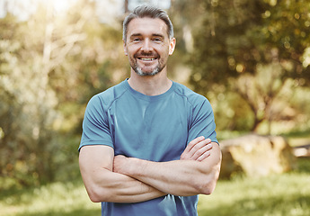Image showing Senior, fitness and portrait of man with arms crossed in a park happy with workout, running or results. Exercise, face and elderly male runner smile in forest for training, workout or body challenge
