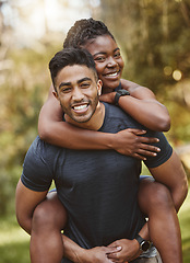 Image showing Fitness, piggy back and portrait of couple outdoors for exercise, training and running for cardio workout. Dating, happy and interracial man carrying woman for wellness, healthy body and sports