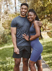 Image showing Fitness, nature and portrait of couple hug outdoors for exercise, training and running for cardio workout. Dating, happy and interracial man and woman embrace for wellness, healthy body and sports