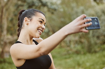 Image showing Happy woman, fitness and smile in nature for selfie, photography or outdoor memory and exercise. Active or sporty female person taking photograph, picture or online social media vlog after workout