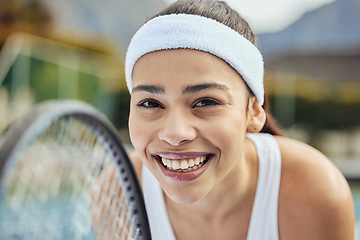 Image showing Badminton, portrait and woman tennis player with a racket practicing to play a match at stadium. Fitness, sports and professional female athlete with equipment for training on court for tournament.