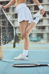 Image showing Court, woman and stretching before tennis game for fitness, exercise and workout outdoor in Cape Town. Flexibility, person and leg training for sport competition, challenge and wellness for body