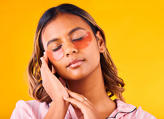 Image showing Woman, eye mask and beauty with skincare, dermatology and cosmetic product on yellow background. Peace, calm and self care treatment with patch, facial for antiaging with glow and wellness in studio