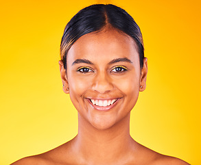 Image showing Woman, face and beauty with skincare, dermatology and natural cosmetics on yellow background. Portrait, smile and self care treatment with facial for antiaging, skin glow and wellness in studio