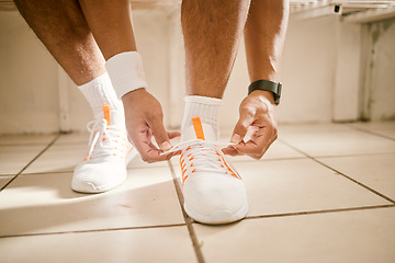 Image showing Locker room, fitness and person tie shoes for training, exercise and workout for practice or match. Sports, gym and closeup of athlete tying laces for performance, wellness and ready for competition