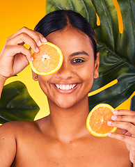 Image showing Woman, orange and beauty with natural skincare, dermatology and cosmetics portrait on yellow background. Monstera, citrus fruit and vegan treatment, green facial for vitamin c and skin glow in studio