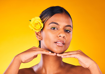 Image showing Woman, rose and natural beauty for skincare, dermatology and cosmetics portrait on yellow background. Spring, eco friendly treatment for self care, facial for antiaging with flower and glow in studio
