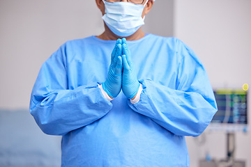 Image showing Doctor, praying and hands with healthcare and surgery, seek guidance from God and worship, hope and operation room. Surgeon person in theatre, prayer and respect with plea, health and ask for help