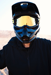 Image showing Helmet, freedom and an off road biker outdoor for a race, competition or adrenaline in summer. Flare, energy and adventure with a sports rider on a course for power or speed in a reflective visor