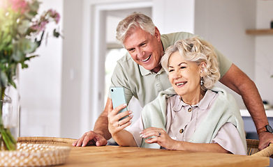 Image showing Senior couple, video call and home with phone, conversation and contact on social media in retirement. Happy elderly man, woman and webinar with smartphone, smile and hello in morning, house or table