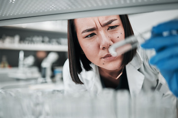 Image showing Test tubes, scientist and confused woman with investigation, thinking and science research. Laboratory, professional and healthcare worker with medicine and liquid check for hospital and clinic test