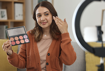 Image showing Streaming, makeup and review with a woman influencer in her home to broadcast live content to viewers. Social media, product or tutorial with a young brand ambassador in the living room for cosmetics