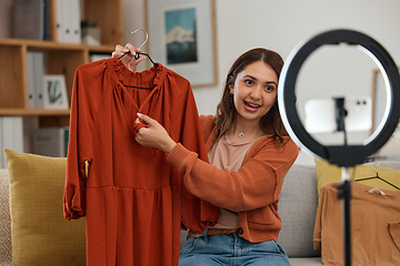 Image showing Influencer woman, show clothes and live stream with ring light, review and talking on social media app. Girl, fashion and web chat with presentation, feedback and broadcast with suggestion in home