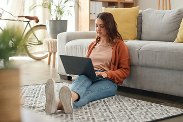 Image showing Woman, laptop and thinking with remote work from home, ideas and analysis for web design job on floor. Freelance entrepreneur, reading and developer for brainstorming, coding and typing in house