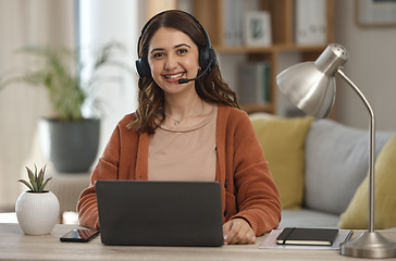 Image showing Portrait, laptop and remote call center with a woman in a home for customer service consulting. Smile, communication or headset with a happy young freelance employee working on a computer for support