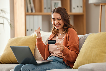 Image showing Excited, woman and laptop with credit card, banking and online shopping with fintech, transaction and happiness in a lounge. Person, home and girl on a couch, pc and celebration with payment or bonus