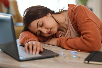 Image showing Remote work from home, woman and sleeping with laptop, burnout and tired with deadline, overworked and resting. Person, freelancer and entrepreneur in a lounge, pc and exhausted with fatigue or relax