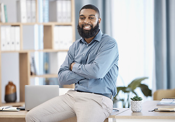 Image showing Man, portrait and office on desk, arms crossed and pose for website as finance professional, smile and happy. Business, management and startup investment capital for corporate venture and employee