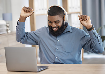 Image showing Business man, success and laptop, headphones or listening to news or announcement of bonus, profit or sales. Professional african employee dance to music or excited for winning and goals on computer