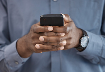 Image showing Phone, hands and closeup of businessman typing a message on the internet or mobile app. Technology, networking and African male person scroll on social media or website with cellphone in the office.