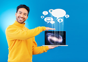 Image showing Laptop, social media icon and portrait of Asian man in studio for internet chat, website or networking. Overlay, computer mockup and person for online communication or connection on blue background