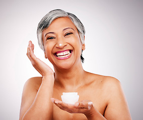 Image showing Beauty, portrait and mature happy woman with cream container, skin hydration product or anti aging lotion. Spa dermatology, melasma skincare cosmetics and studio model face on gray background